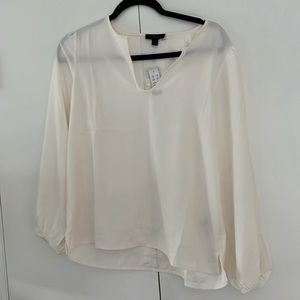 NWT J. Crew cream artist style blouse. Cinched wrists, open bottom.